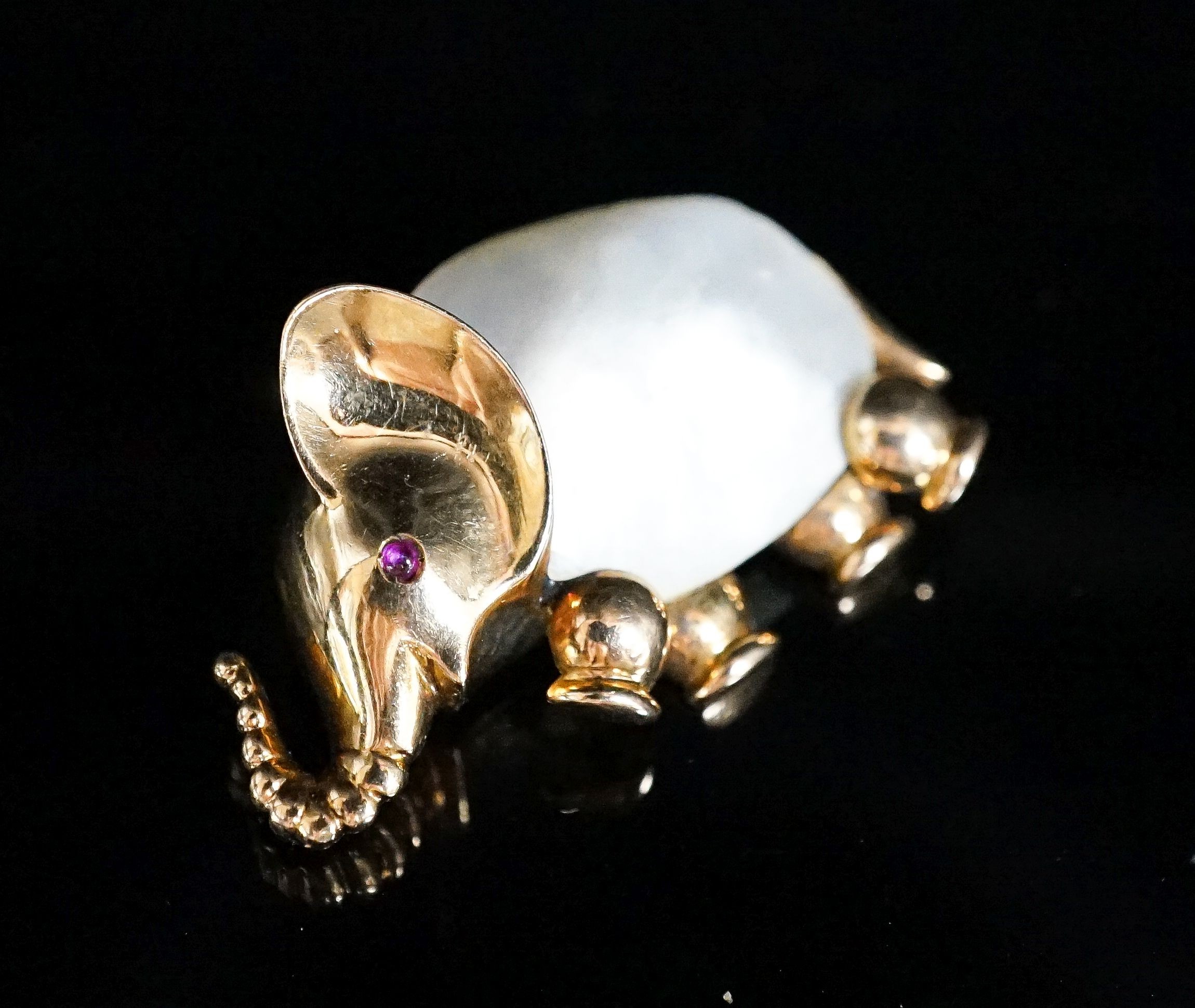 A 20th century Viennese 585 yellow metal, mother of pearl and ruby chip set brooch, modelled as an elephant, 35mm, gross weight 12.7 grams.